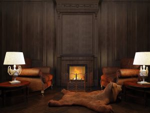 two armchairs and two lamps at the fireplace